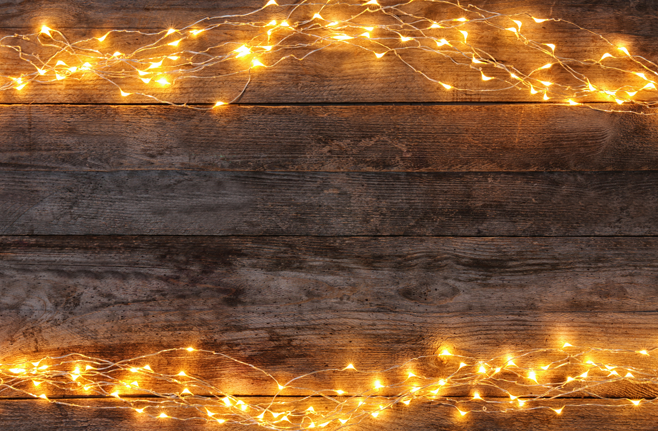 Festive Christmas Lights on Wooden Background